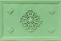 Rosette decoration on an old light green iron cast door Royalty Free Stock Photo