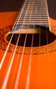 Rosette and strings of an acoustic guitar close up. Classical Spanish guitar. Musical instrument Royalty Free Stock Photo
