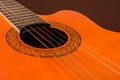 Rosette and strings of an acoustic guitar close up. Classical Spanish guitar. Royalty Free Stock Photo