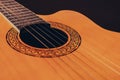 Rosette and strings of an acoustic guitar close up. Classical Spanish guitar. Musical instrument Royalty Free Stock Photo