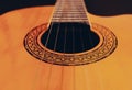 Rosette and strings of an acoustic guitar close up. Classical Spanish guitar. Musical instrument Royalty Free Stock Photo