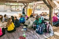 Schoolchildren make handmade work from pieces of tiles at the entrance to the archaeological site of Tel Shilo in Samaria region