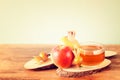 Rosh hashanah concept - apple honey and pomegranate over wooden table Royalty Free Stock Photo