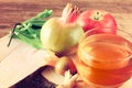 Rosh hashanah concept - apple honey and pomegranate over wooden table. Royalty Free Stock Photo