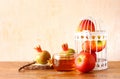 Rosh hashanah concept - apple honey and pomegranate over wooden table. Royalty Free Stock Photo