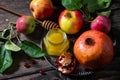 Rosh hashanah hashana - jewish new year holiday concept. Traditional symbols: honey, fresh apples and pomegranate Royalty Free Stock Photo