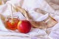 Rosh hashanah (jewesh holiday) concept - honey, apple and pomegranate over wooden table. traditional holiday symbols.