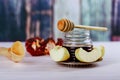 rosh hashanah jewesh holiday concept - shofar, torah book, honey, apple and pomegranate over wooden table. a kippah a yamolka Royalty Free Stock Photo