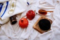 rosh hashanah jewesh holiday concept - shofar, torah book, honey, apple and pomegranate over wooden table. a kippah a yamolka Royalty Free Stock Photo