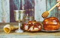 rosh hashanah jewesh holiday concept - shofar, torah book, honey, apple and pomegranate over wooden table Royalty Free Stock Photo