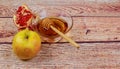 rosh hashanah jewesh holiday torah book, honey, apple and pomegranate over wooden table. traditional symbols. Royalty Free Stock Photo