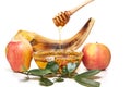 Rosh hashanah - jewish new year holiday concept. An apple-shaped bowl with honey, apples, a shofar are traditional Royalty Free Stock Photo