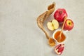 Rosh hashanah, jewish New Year holiday concept. Pomegranate, apples and honey traditional products for celebration Royalty Free Stock Photo