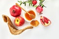 Rosh hashanah, jewish New Year holiday concept. Pomegranate, apples and honey traditional products for celebration Royalty Free Stock Photo