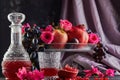 Rosh hashanah - jewish New Year holiday concept. Still life of fresh autumn fruits and pomegranate juice in a decanter and a glass Royalty Free Stock Photo