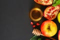 Rosh hashanah jewish New Year holiday concept. Traditional symbol. Apples, honey, pomegranate. Copy space. Top view. Flat lay. Royalty Free Stock Photo