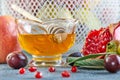 Rosh hashanah - jewish New Year holiday concept. Traditional symbols: Honey jar and fresh apples with pomegranate and basket with Royalty Free Stock Photo