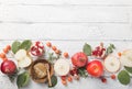 Rosh hashanah - jewish New Year holiday concept. Traditional symbols: Honey jar and fresh apples with pomegranate and shofar -horn Royalty Free Stock Photo