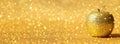 Rosh hashanah & x28;jewish New Year holiday& x29; concept. Traditional symbol, decorative glitter gold apple. Royalty Free Stock Photo