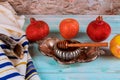 Shofar and tallit with honey jar and fresh ripe apples. Jewish new year Yom Kippur and Rosh Hashanah