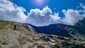 Roshka - A man enjoying the panoramic view from the Chaukhi Pass in the Greater Caucasus Mountain Range in Georgia.