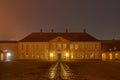 Roskilde Palace, a yellow mansion at night