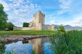 Ross Castles on edge and reflected in Killarney`s lower lake in National Park Royalty Free Stock Photo