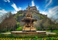 Ross Fountain in garden with Edinburgh Castle on blue sky at United Kingdom Royalty Free Stock Photo