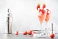 Rossini alcoholic cocktail with Italian sparkling wine, strawberry puree and ice in champagne glasses, place for text, selective Royalty Free Stock Photo