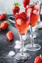 Rossini alcoholic cocktail with Italian sparkling wine, strawberry puree and ice in champagne glasses, place for text, selective Royalty Free Stock Photo