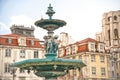 Rossio Square with fountain and sculpture, Lisbon Royalty Free Stock Photo