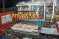 Rosted chicken and fish grilled at a movable market stall in Bangkok