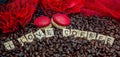 rosted coffee beans with red macaroon red flowers and letters I LOVE Coffee