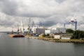 The industrial harbour in Rostock with a lot of cranes, heavy equipments and ships Royalty Free Stock Photo