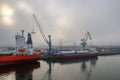 cargo boat tasman, carrying parts for a wind power plant in the harbour Royalty Free Stock Photo