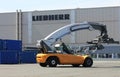 Port equipment. Reach stacker in the test area of Liebherr crane building factory, Germany. Reach stacker is a container loader.