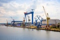 Rostock, Germany - 17.06.2018: Port facility with cranes and shipyard in the port of Rostock