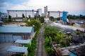 Industrial zone of a city with grain elevator and railway Royalty Free Stock Photo