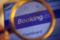 A search engine for booking hotels around the world, close-up under a magnifying loupe Royalty Free Stock Photo