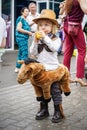 ROSTOV-ON-DON, RUSSIA - 20 May, 2018. Festival Ball of Babies. A beautiful little boy and in a festive dress and carnival cowboy