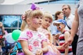 ROSTOV-ON-DON, RUSSIA - 20 May, 2018. Festival Ball of Babies. A beautiful little girl and in a festive dress and carnival mask