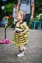 ROSTOV-ON-DON, RUSSIA - 20 May, 2018. Festival Ball of Babies. A beautiful little girl and in a festive dress and carnival mask