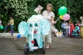 ROSTOV-ON-DON, RUSSIA - 20 May, 2018. Festival Ball of Babies. Mom with a carnival stroller in an elephant costume
