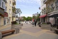 Pedestrians are walking along Soborniy Lane