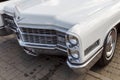 Fore part of the vintage car Cadillac Coupe de Ville in white colour at the exhibition of retro cars