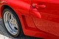 View of the rear wheel and the air intake of the sports car Porsche 944 at the city exhibition of retro cars Royalty Free Stock Photo