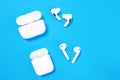 Rostov, Russia - July 06, 2020: Comparison of two generations of wireless headsets for Apple smartphones - AirPods and