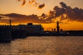 Rostral columns with fire on Vasilyevsky island Spit Strelka at sunset. St. Petersburg. Russia