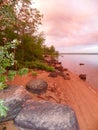 Rosy pink sunrise along the Ottawa River shoreline in Canada Royalty Free Stock Photo