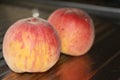 Rosy ripe Kuban peach close-up on a metal table